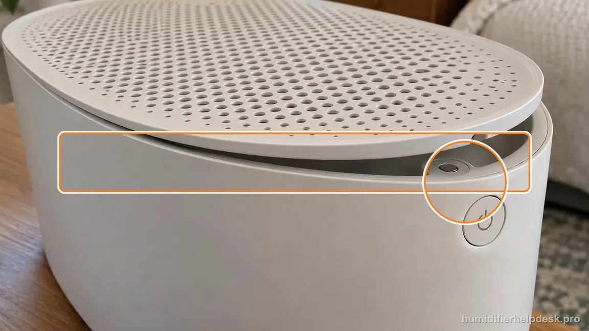 Instructional repair photo: the magnetic grate is visibly unseated at the power-button side.