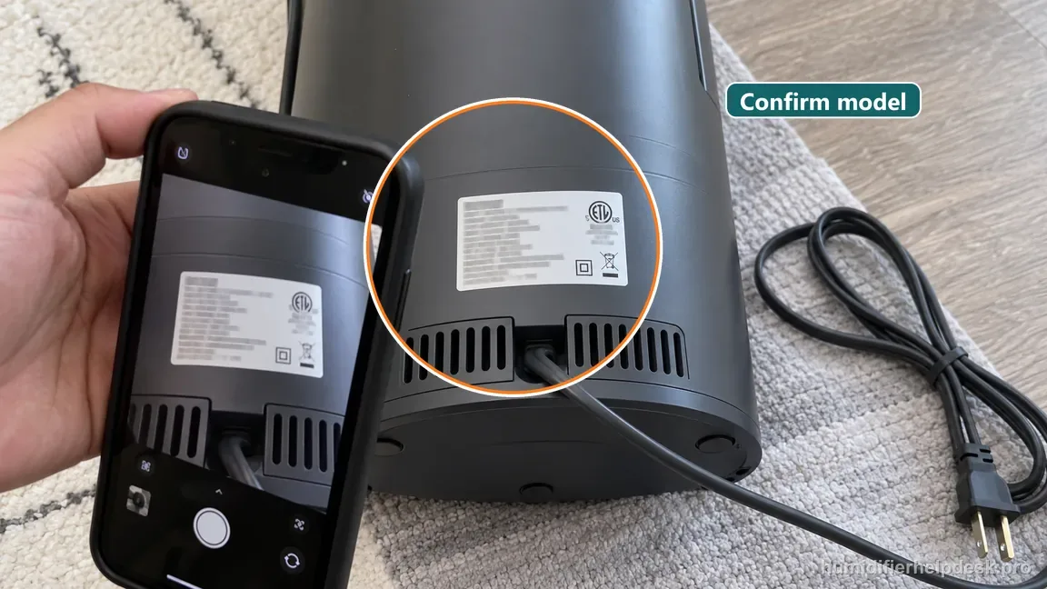 The unplugged OasisMist 1000S is shown from the rear while its manufacturer identification label is photographed to confirm model details.